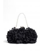 Bolso de mano con cadena de perlas inspirado en Bloom en color negro