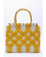 Bolso de mano tejido bicolor con asa de bambú en amarillo